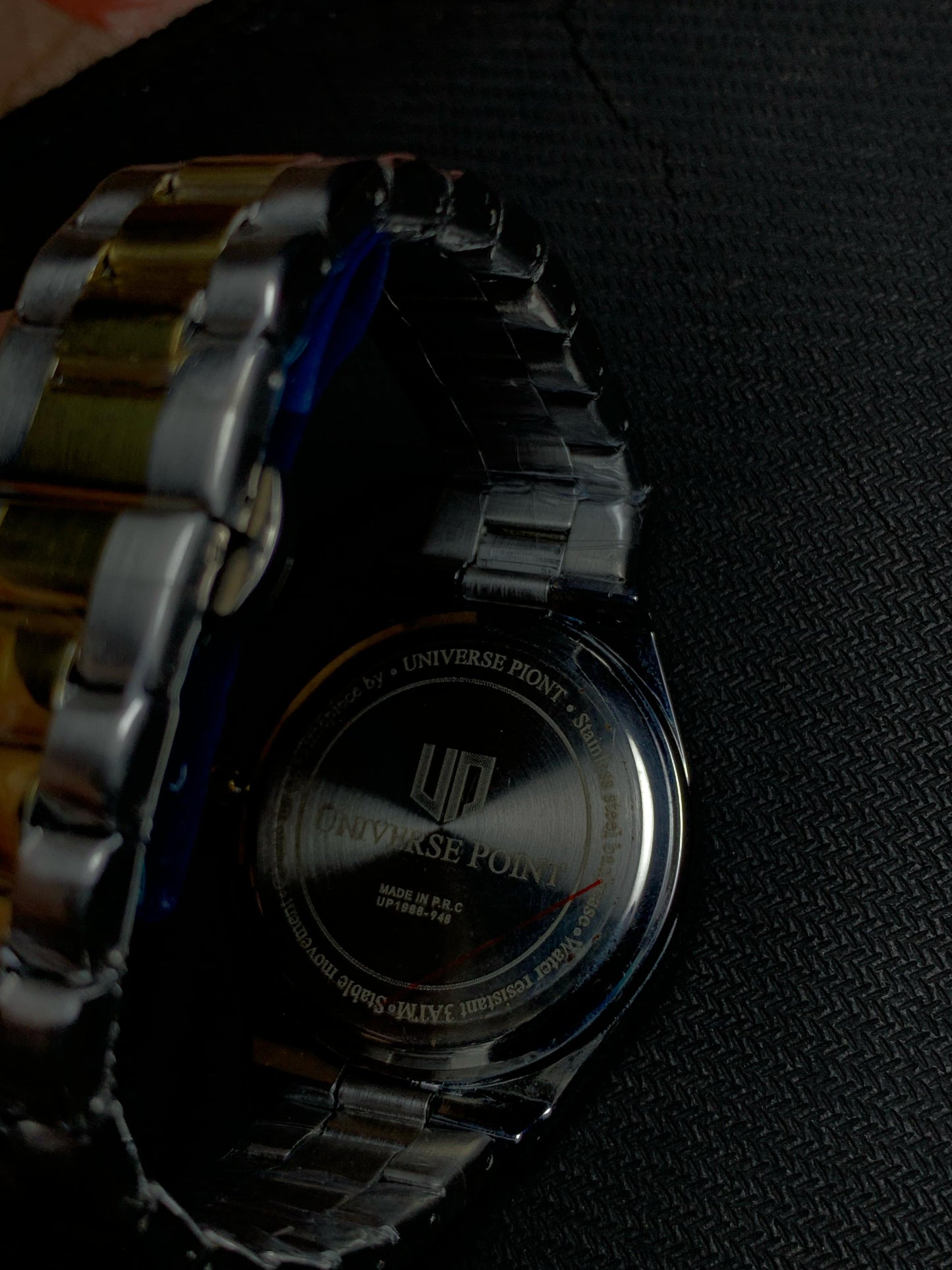Universe Luxury Silver Grey Watch With Gold Silver Straps And Neon Hours.