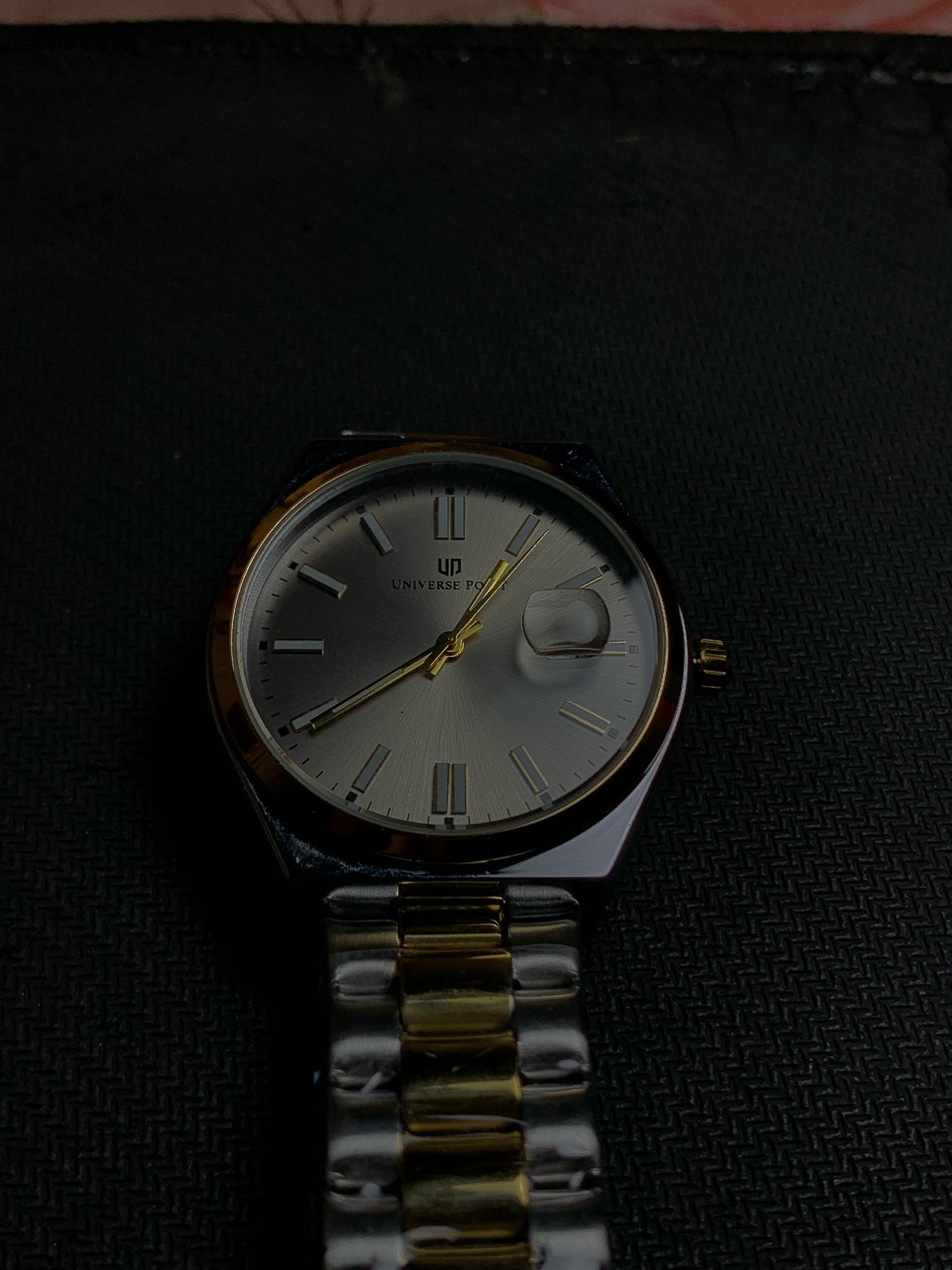 Universe Luxury Silver Grey Watch With Gold Silver Straps And Neon Hours.
