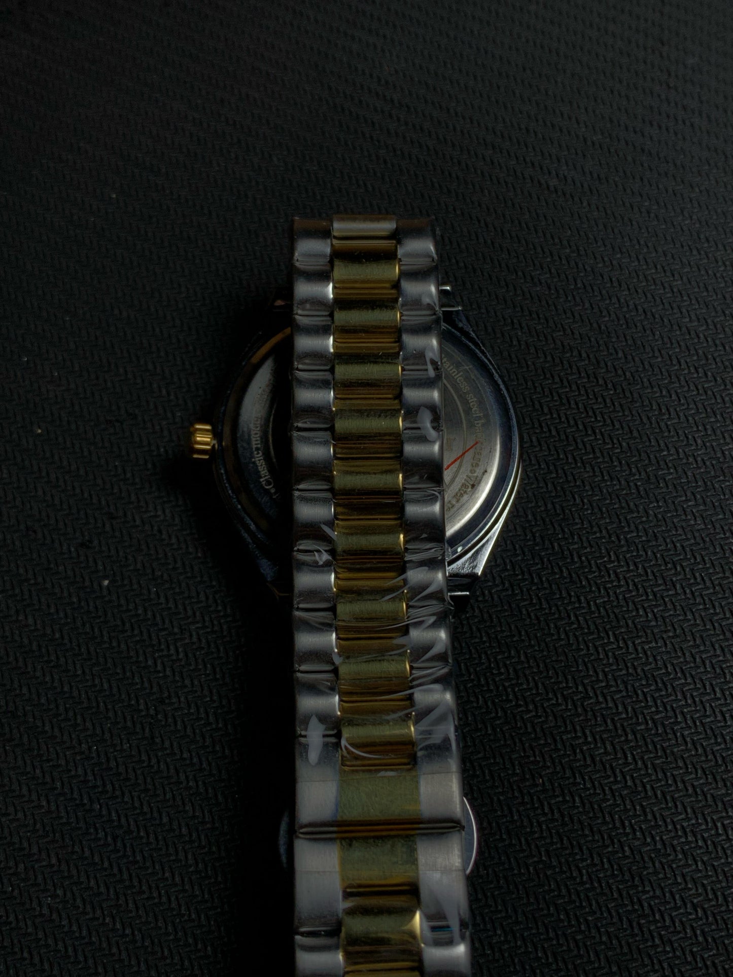 Universe Luxury Silver Grey Watch With Gold Silver Straps And Neon Hours.